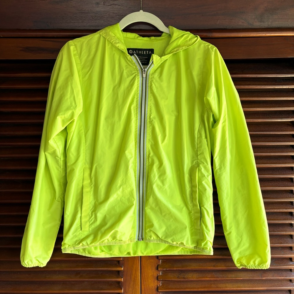 Athleta S neon yellow windbreaker with hoodie pockets and back zippered pocket